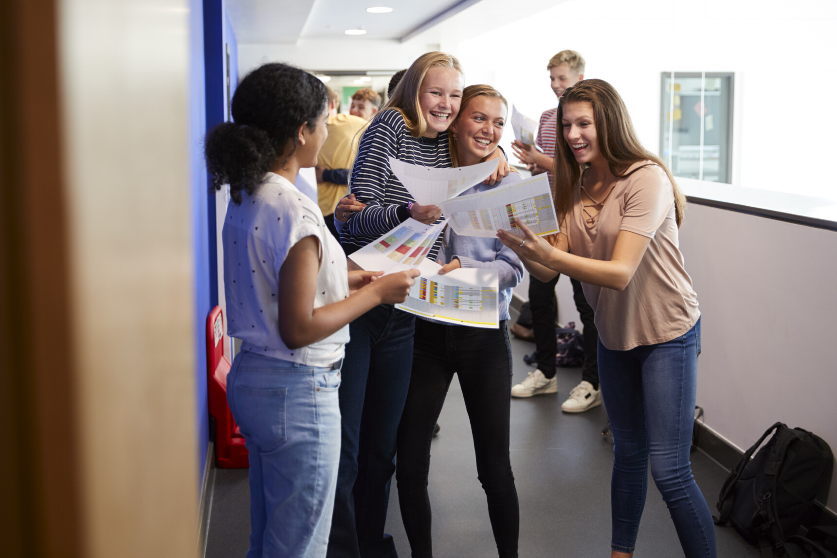 Students hugging and celebrating their exam results on Results Day.