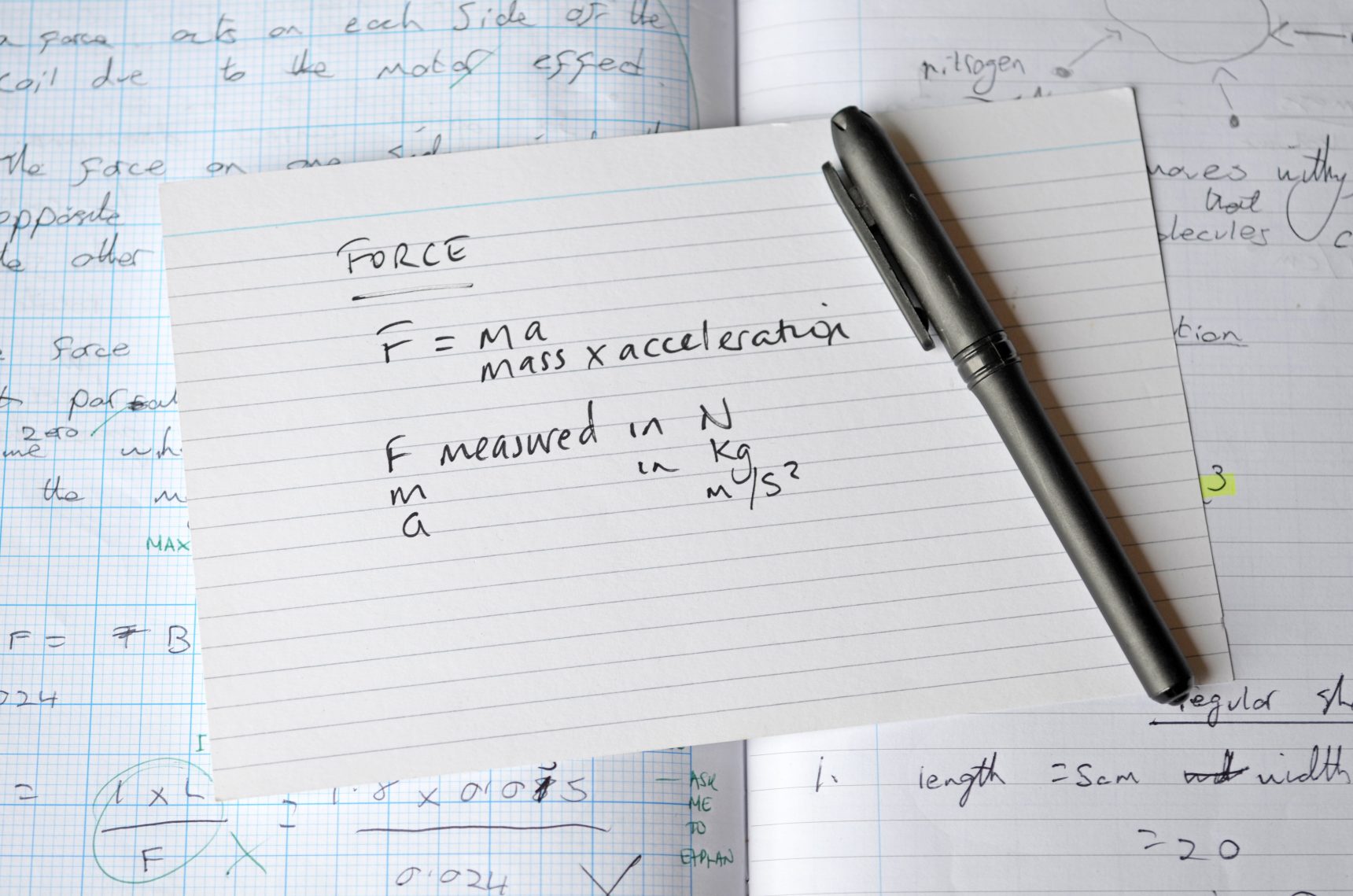 A Level Physics revision flashcards and an exercise book to illustrate that flashcards are one of the best active revision techniques.