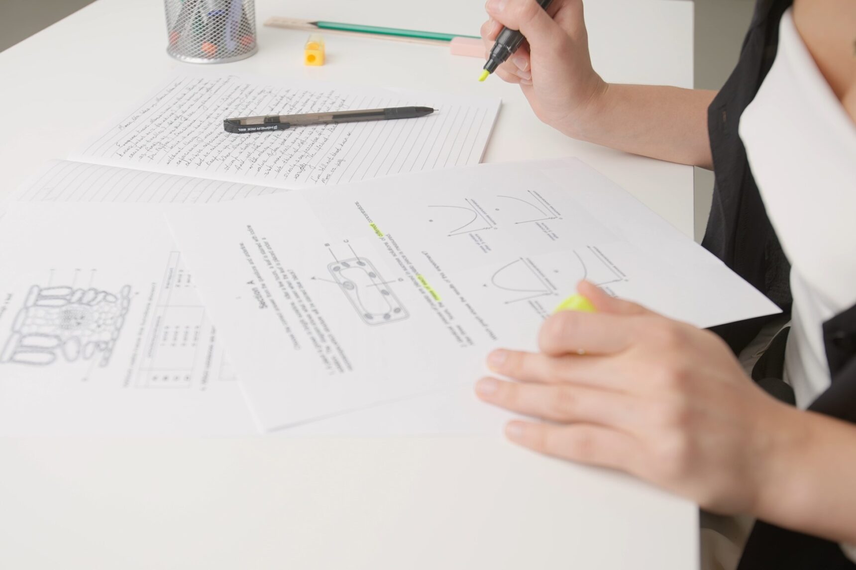 Student completing biology predicted paper.