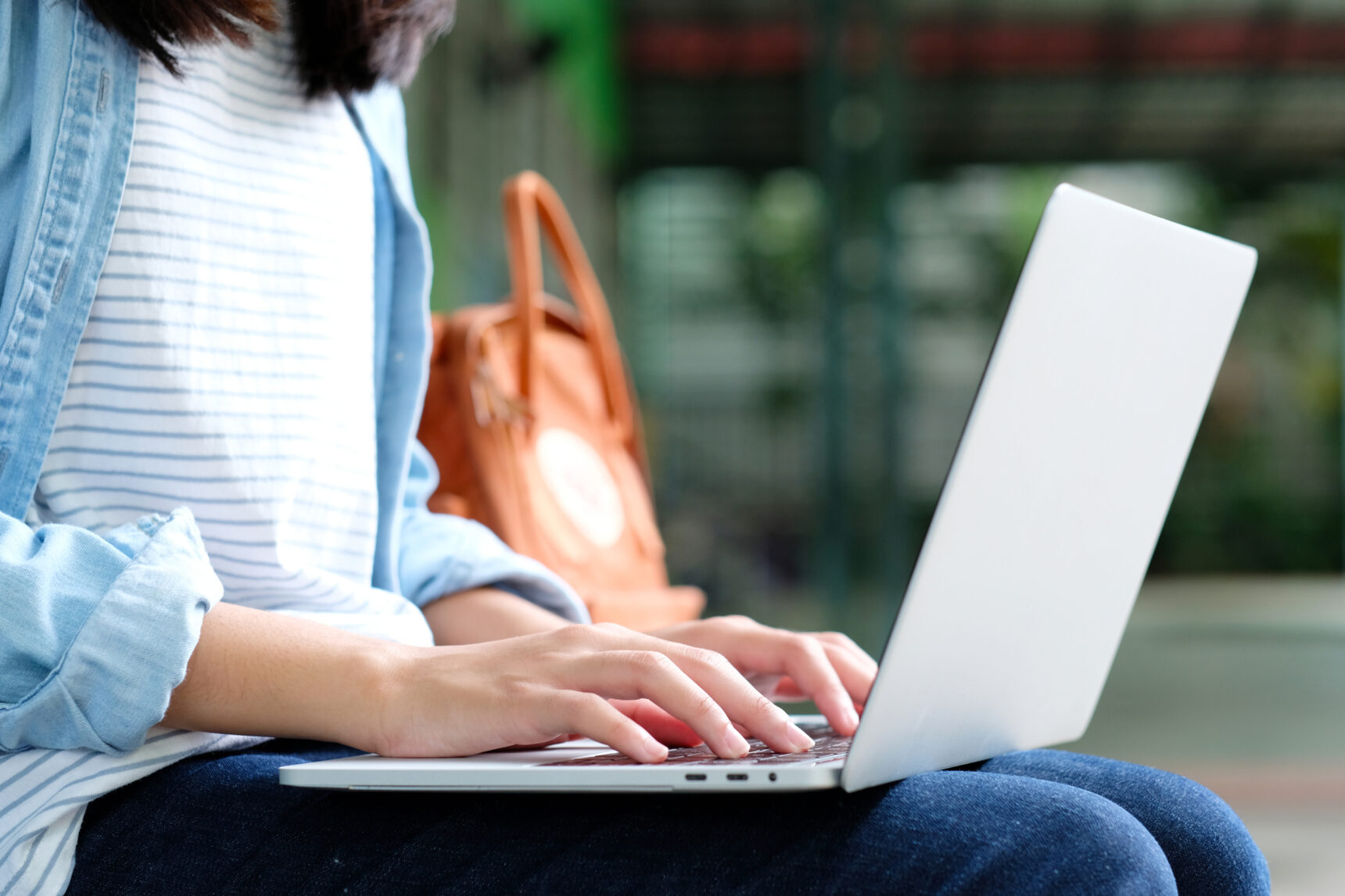 A female student is checking her e-mails on her laptop to find out the result of her A Level remark.