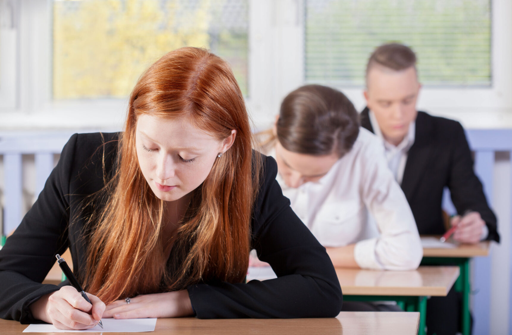 A group of A level students sitting an exam.