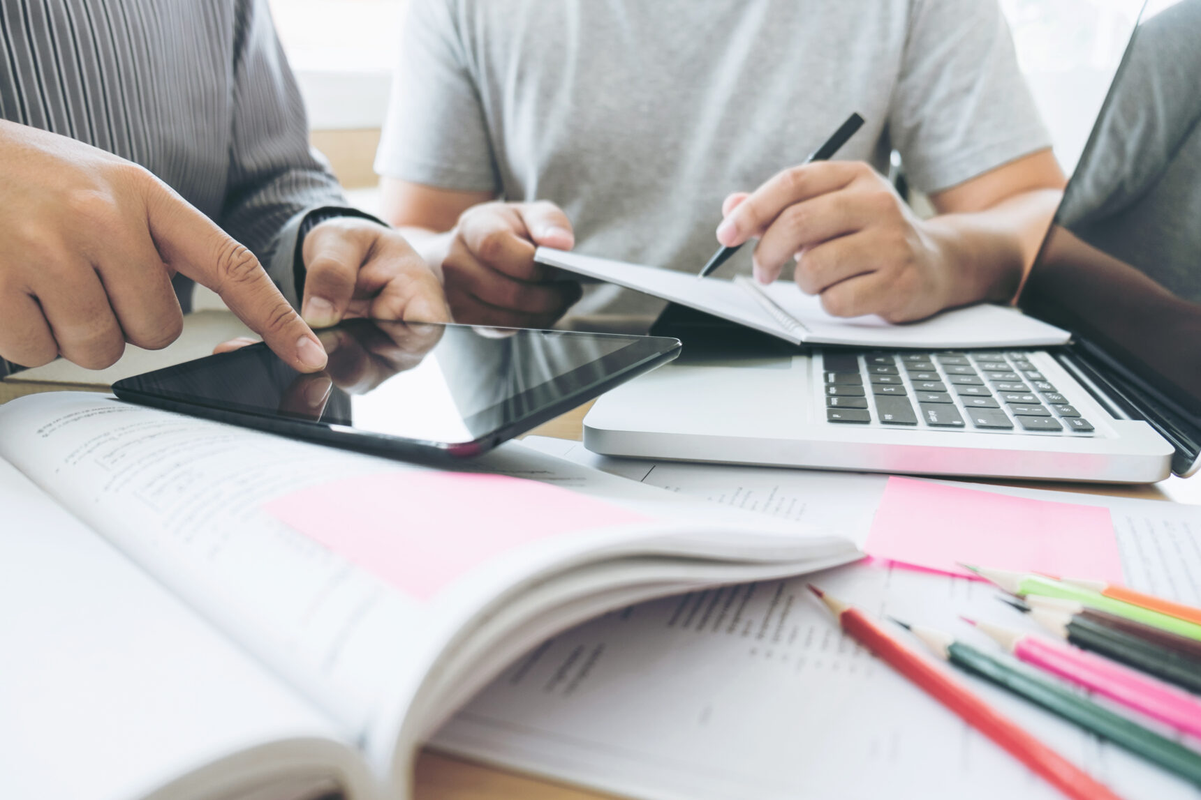 A teacher is using a classroom app on their tablet to support student learning during a lesson.