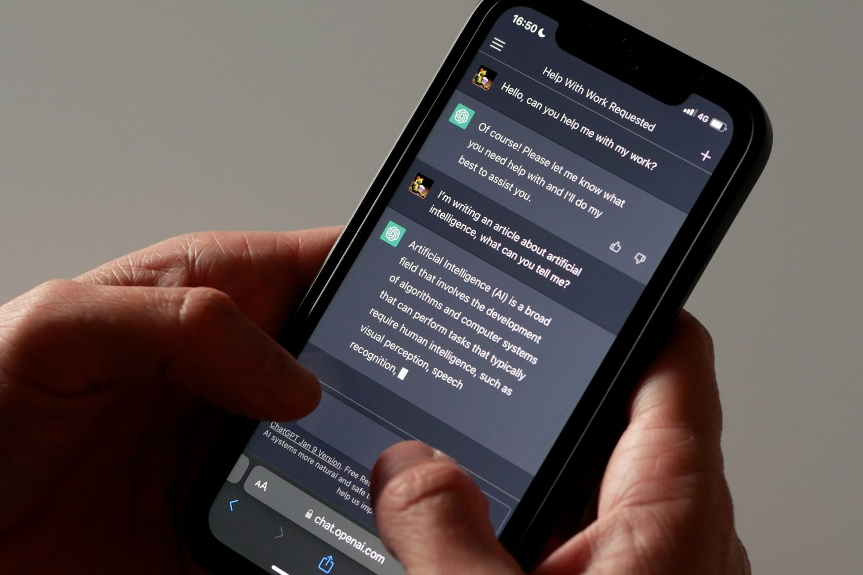 A student asking ChatGPT a question on their mobile phone.