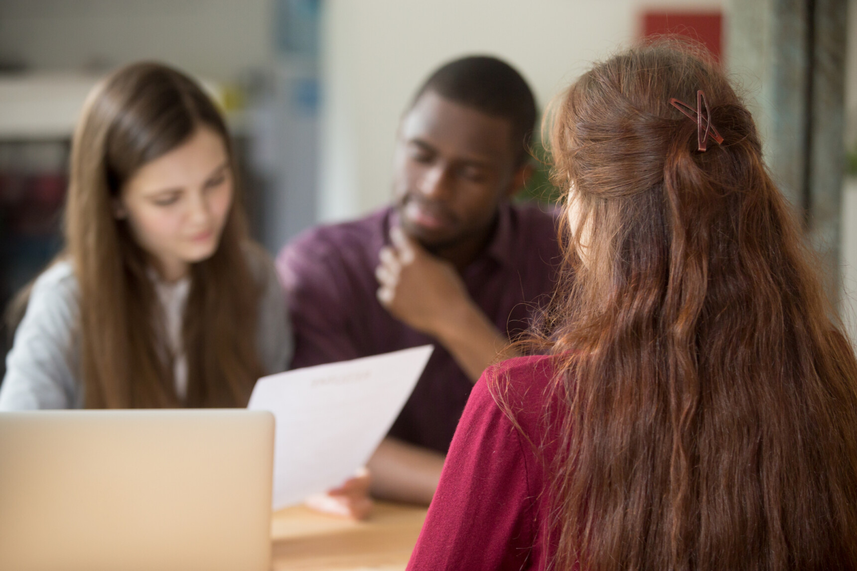 Prospective students speaking to a student ambassador at a university open day.